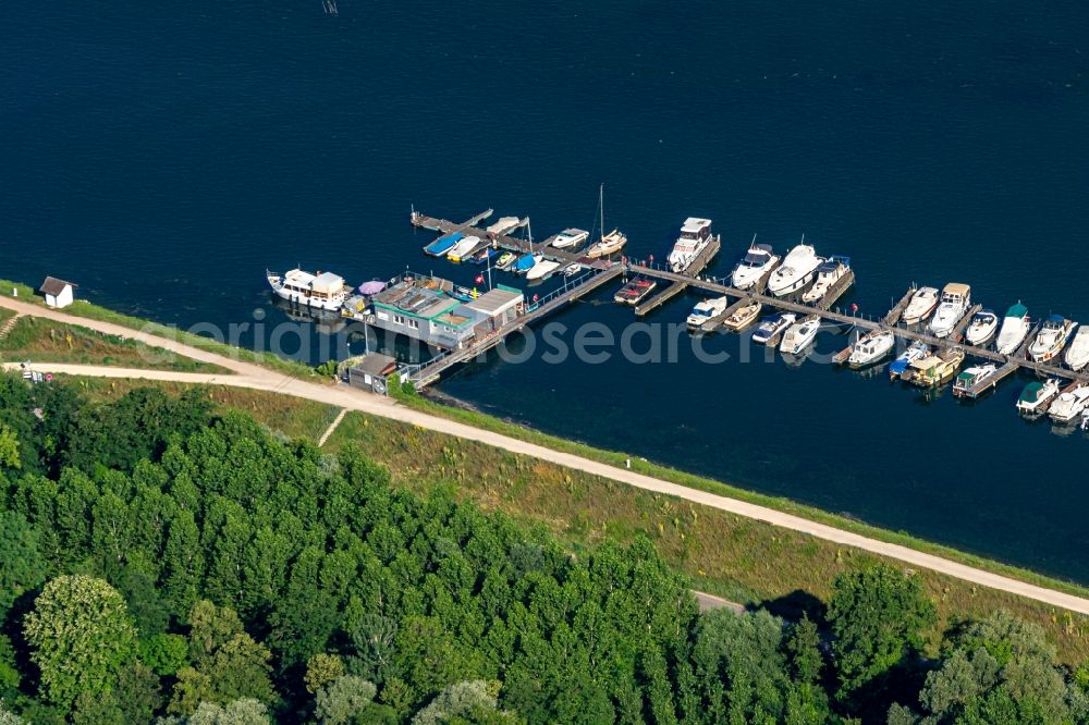 Weisweil from the bird's eye view: Pleasure boat marina with docks and moorings on the shore area on Rhein in Weisweil in the state Baden-Wurttemberg, Germany