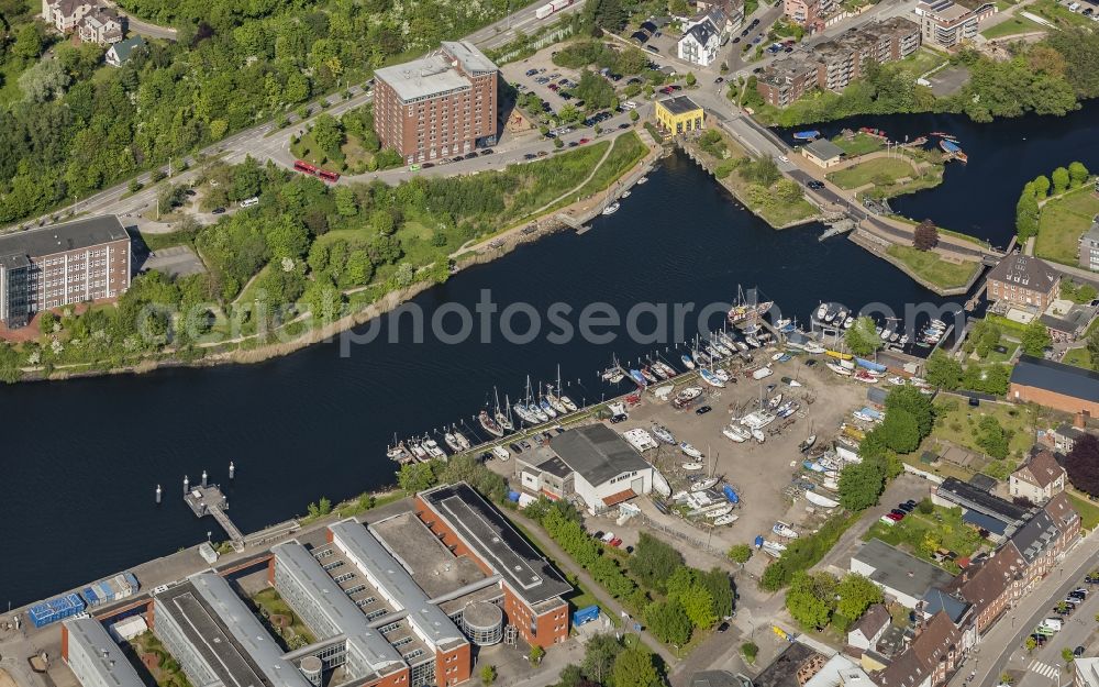 Kiel from the bird's eye view: Pleasure boat marina with docks and moorings on the shore area of Schwentine in Kiel in the state Schleswig-Holstein, Germany