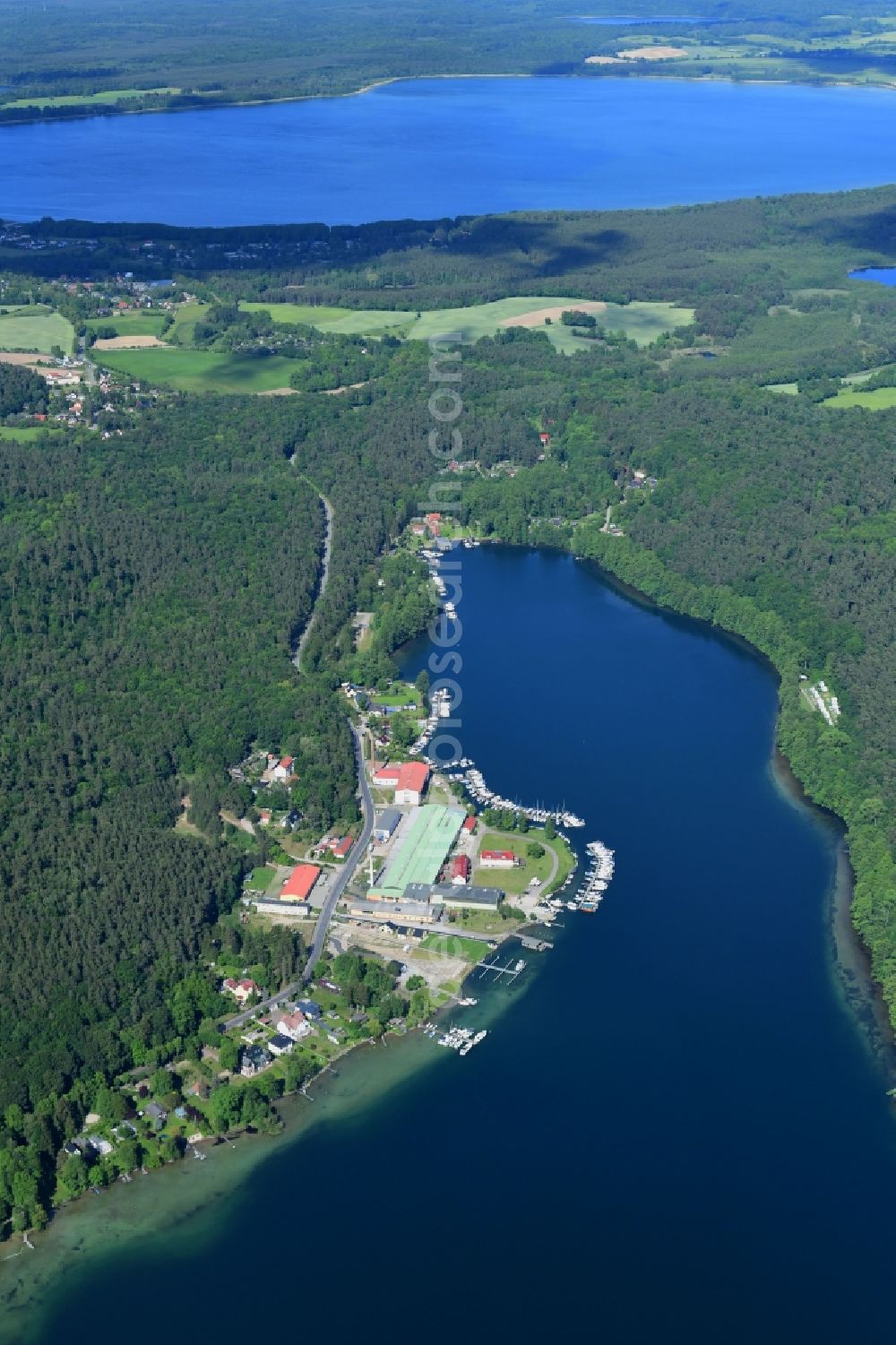 Joachimsthal from above - Pleasure boat marina with docks and moorings on the shore area of Werbellinsee on Seerandstrasse in Joachimsthal in the state Brandenburg, Germany