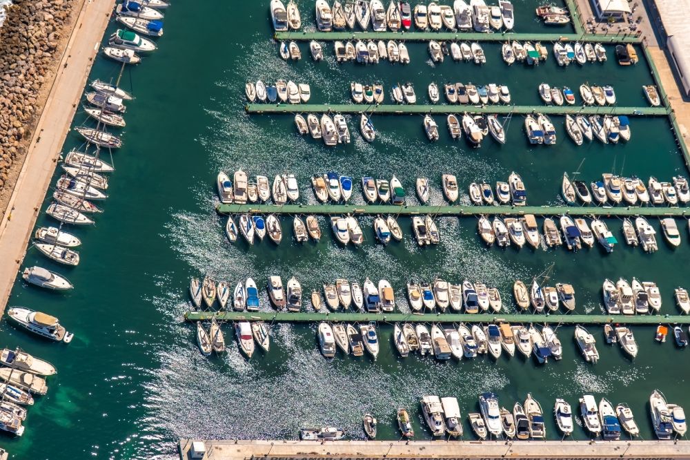 Can Picafort from above - Pleasure boat marina with docks and moorings on the shore area on Carrer Cervantes in Can Picafort in Balearic island of Mallorca, Spain