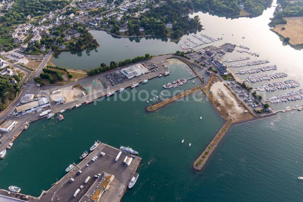 Loctudy from the bird's eye view: Pleasure boat marina with docks and moorings on the shore area of Marina - Port de Plaisance in Loctudy in Brittany, France