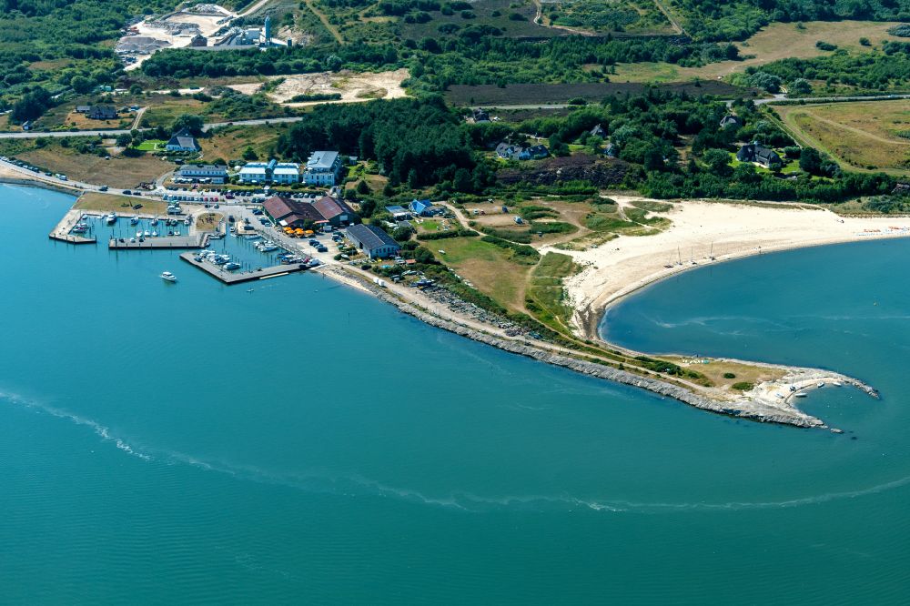 Munkmarsch from above - Pleasure boat marina with docks and moorings on the shore area northern sea in Munkmarsch at the island Sylt in the state Schleswig-Holstein, Germany