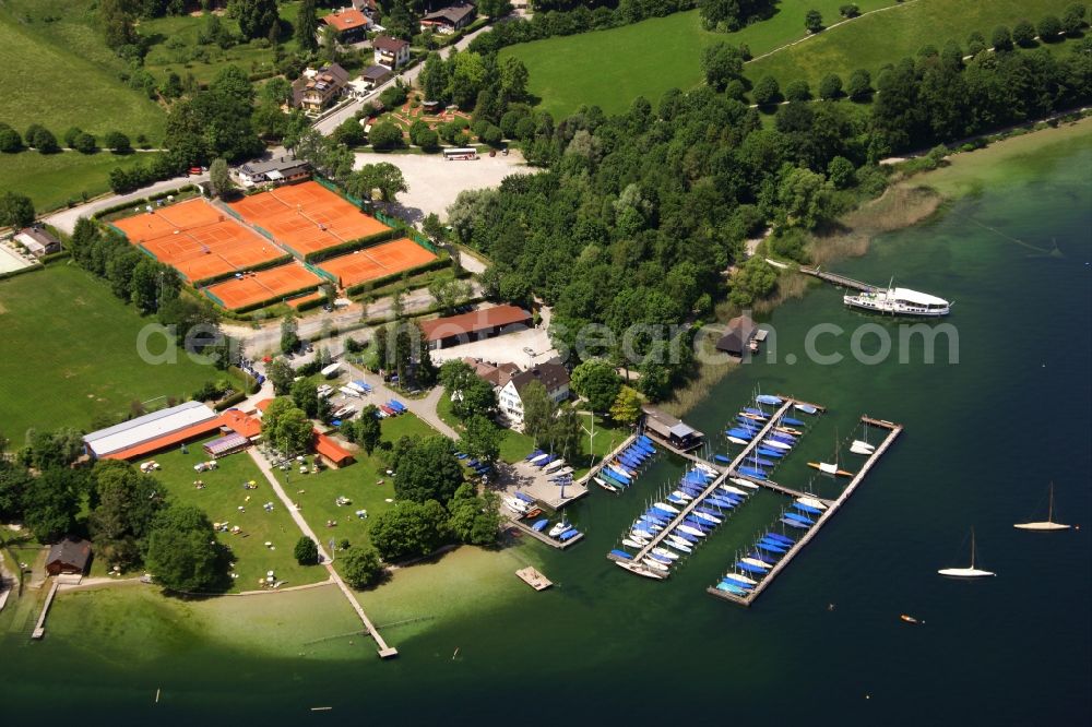 Aerial photograph Tutzing - Pleasure boat marina with docks and moorings on the shore area of Starnberger See in the district Unterzeismering in Tutzing in the state Bavaria, Germany