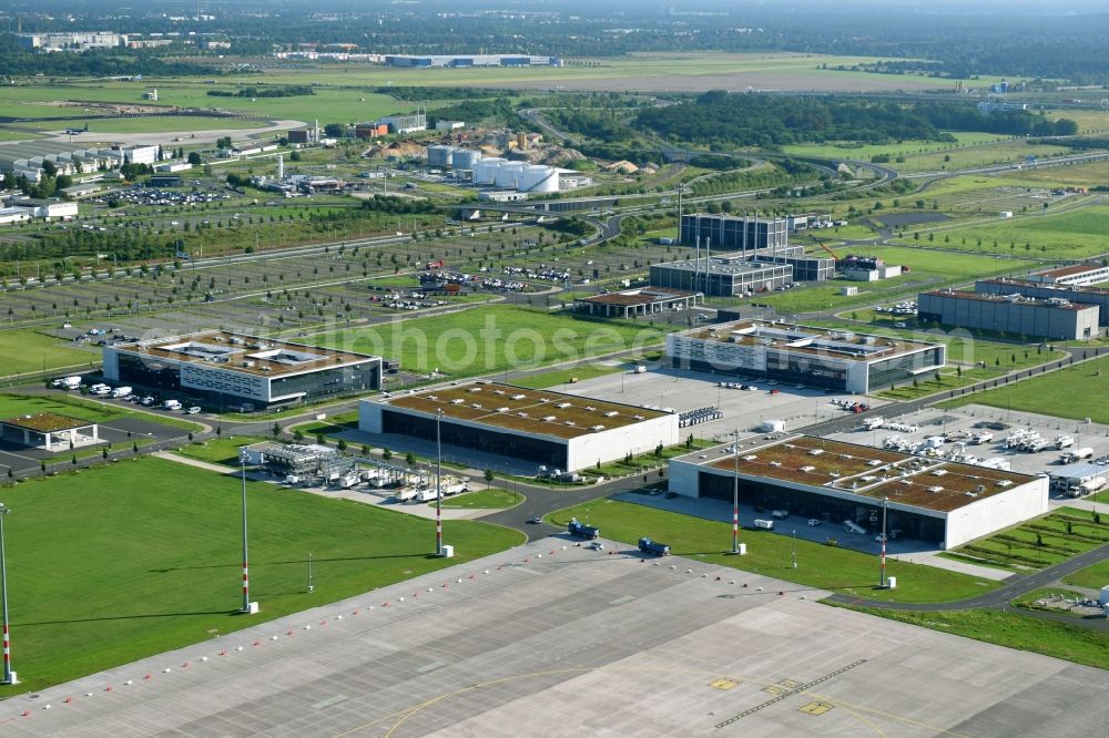 Schönefeld from the bird's eye view: Mostly untapped technical installations in buildings of making sure the infrastructure area of the airport BER in Schoenefeld in Brandenburg