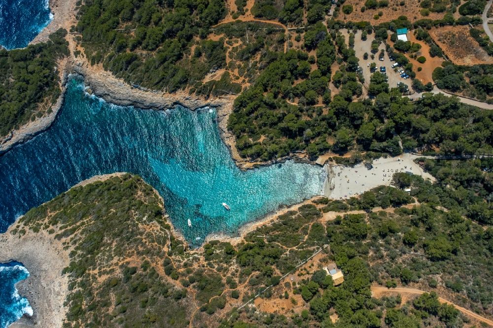 Vertical aerial photograph Felanich - Vertical aerial view from the satellite perspective of the water surface at the bay along the sea coast with the beach of the bay Cala Sa Nau in Felanich in Balearic island of Mallorca, Spain