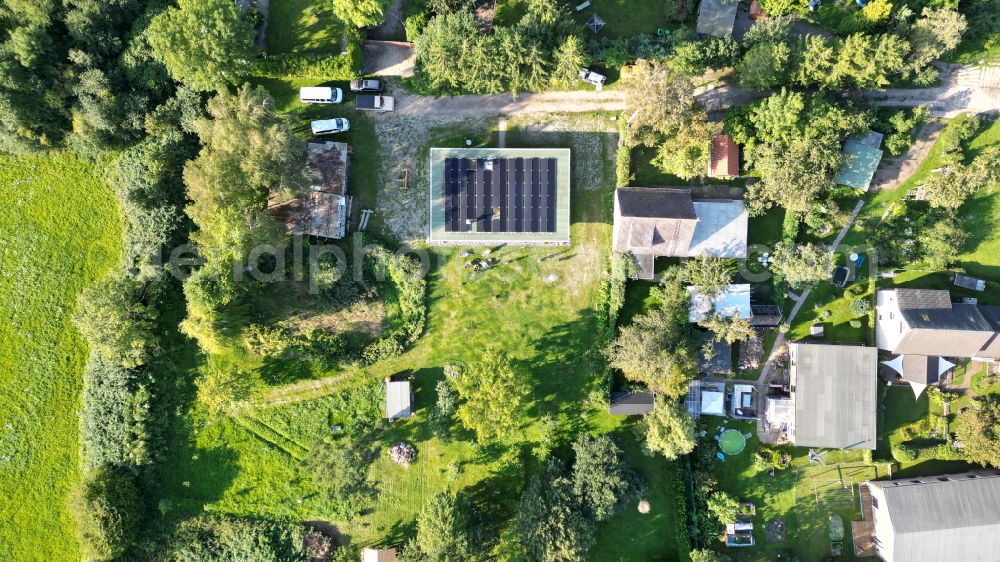 Vertical aerial photograph Kenz - Vertical aerial view from the satellite perspective of the construction site for the new construction of a detached house in a family house - settlement along the on street Zu den Dorfwiesen in Kenz in the state Mecklenburg - Western Pomerania, Germany