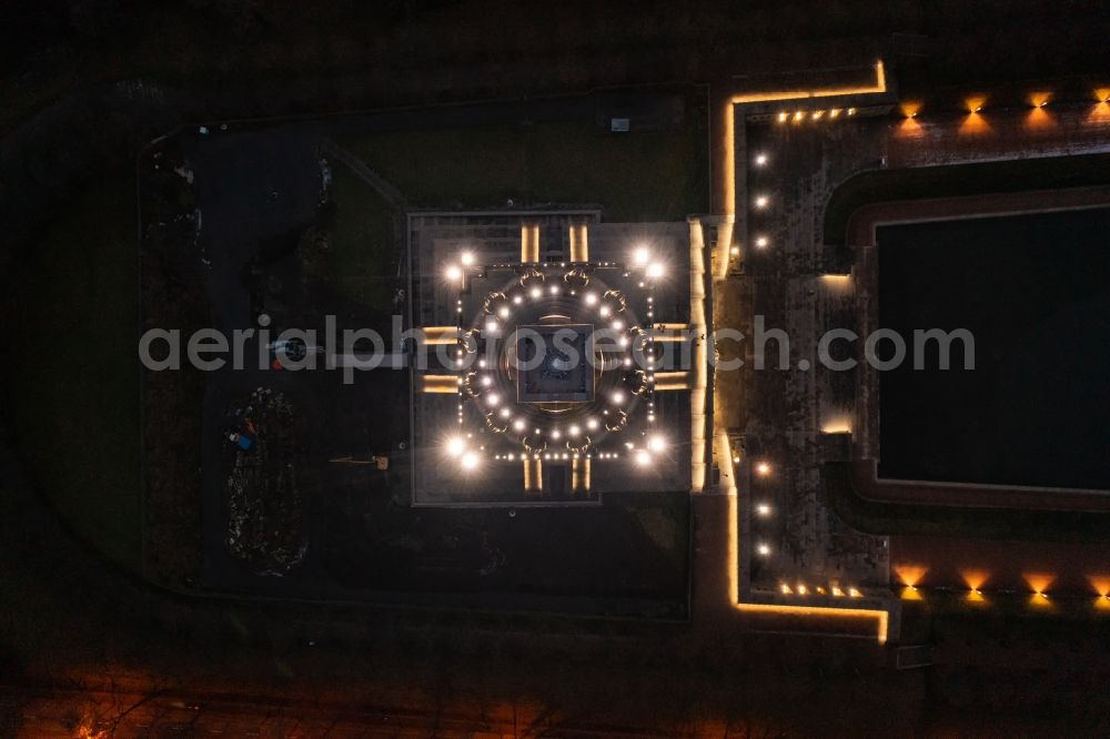 Vertical aerial photograph Leipzig - Vertical aerial view from the satellite perspective of the night lighting Tourist attraction of the historic monument Voelkerschlachtdenkmal on Strasse of 18. Oktober in Leipzig in the state Saxony, Germany