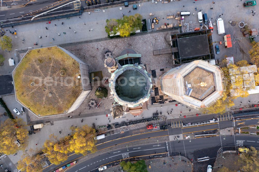 Vertical aerial photograph Berlin - Vertical aerial view from the satellite perspective of the the Protestant Kaiser William Memorial Church (colloquially known Memorial Church and in Berlin dialect called Hollow Tooth) is located at Breitscheidplatz between the Kurfuerstendamm, the Tauentzienstrasse and the Budapest street in Berlin's Charlottenburg district
