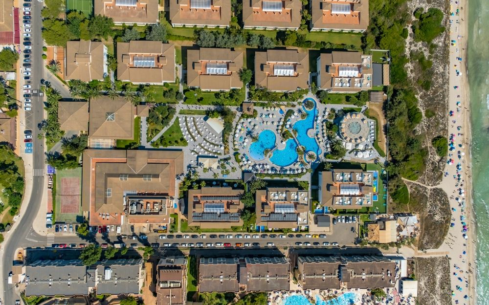 Vertical aerial photograph Can Picafort - Vertical aerial view from the satellite perspective of the refreshing swim in the blue pool - swimming pool of the hotel Playa Garden Selection Hotel & Spa on Avenida Platges de Muro in Can Picafort in Balearic island of Mallorca, Spain