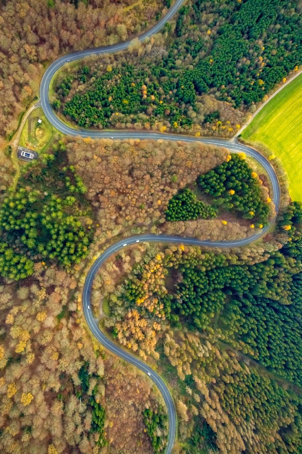 Vertical aerial photograph Redlendorf - Vertical aerial view from the satellite perspective of the serpentine-shaped curve of a road guide of federal street L323 in a forest in Redlendorf in the state North Rhine-Westphalia, Germany