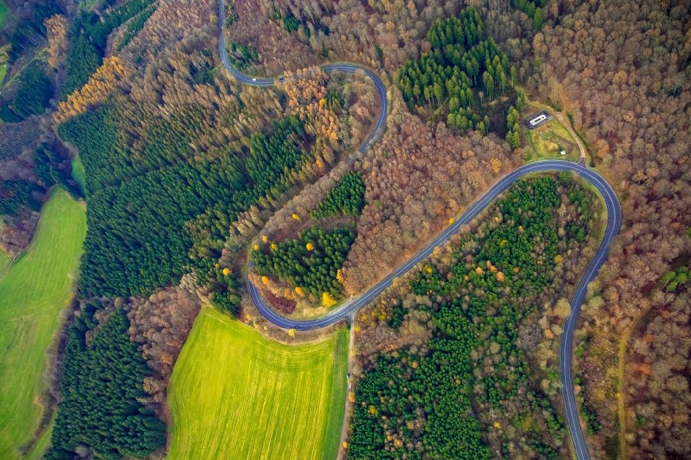 Vertical aerial photograph Redlendorf - Vertical aerial view from the satellite perspective of the serpentine-shaped curve of a road guide of federal street L323 in a forest in Redlendorf in the state North Rhine-Westphalia, Germany