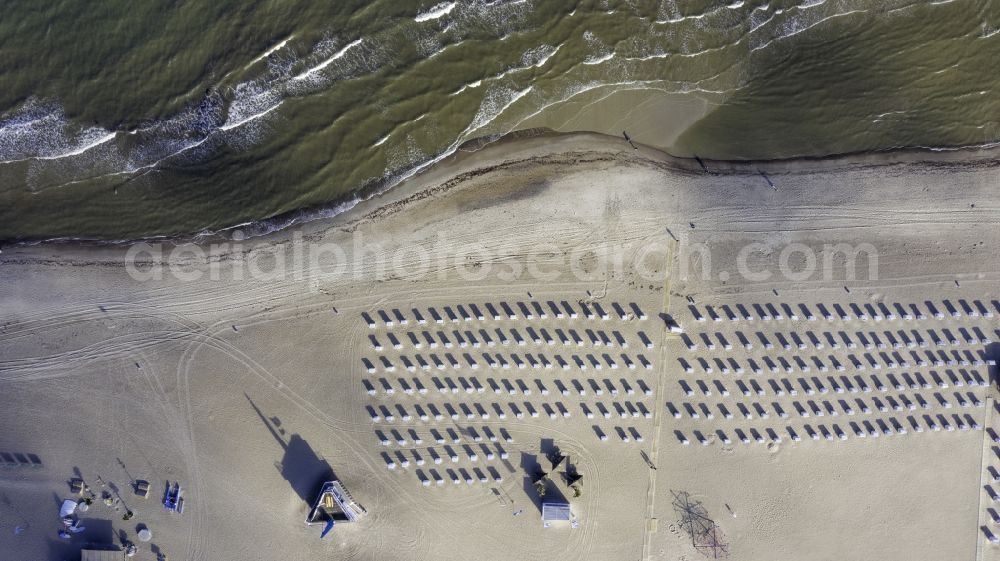 Vertical aerial photograph Rostock - Vertical aerial view from the satellite perspective of the beach chair on the sandy beach ranks in the coastal area of Baltic Sea in the district Warnemuende in Rostock in the state Mecklenburg - Western Pomerania, Germany