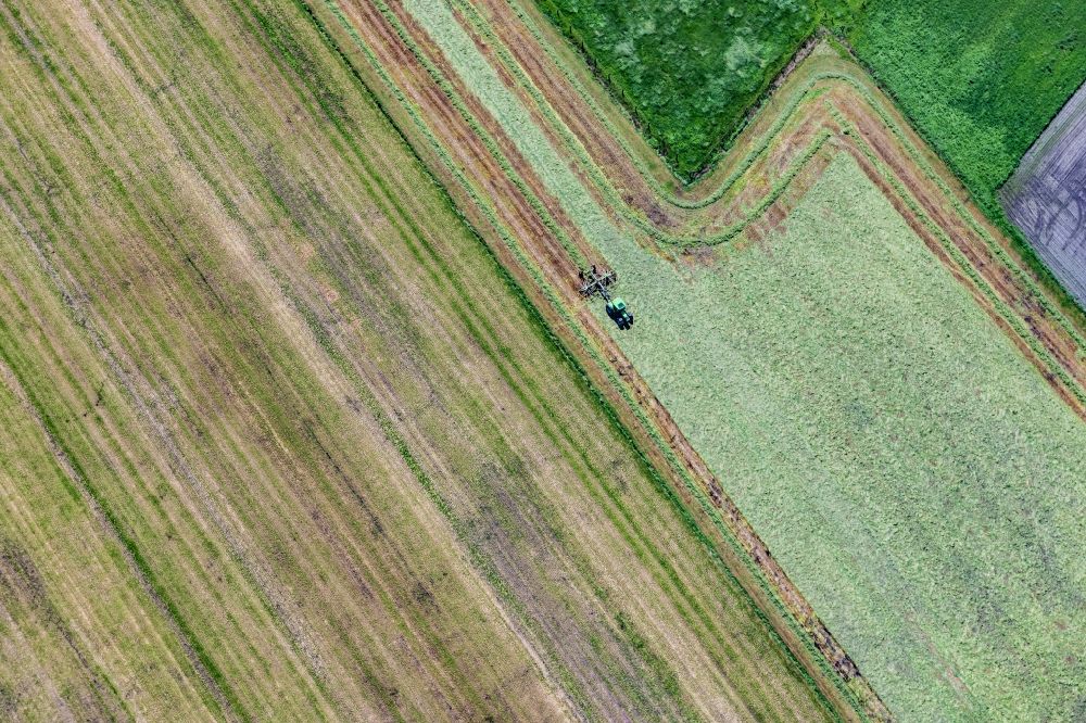 Vertical aerial photograph Heinbockel - Vertical aerial view from the satellite perspective of the transport vehicles in agricultural fields in Heinbockel in the state Lower Saxony, Germany